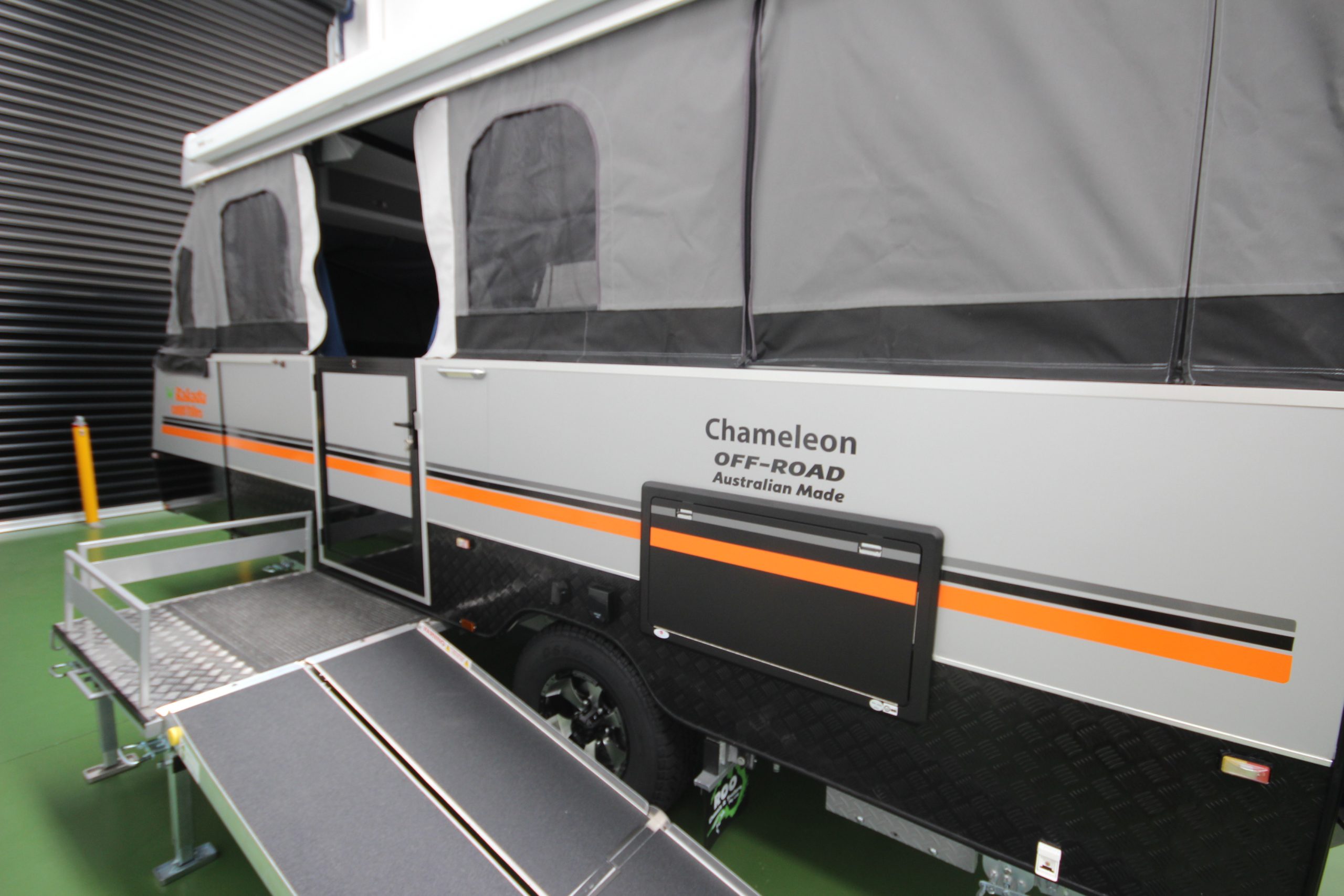 Picture of wheelchair accessible camper trailer with ramp extended